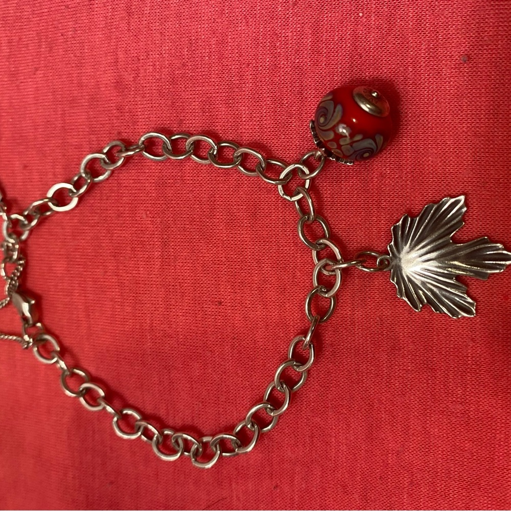 James Avery Charm bracelet authentic silver large. Two charms . Leaf is retired.